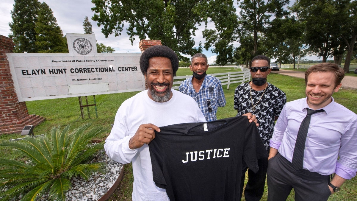 Sullivan Walter holds a shirt near Elayn Hunt Correctional Center in St. Gabriel, Louisiana
