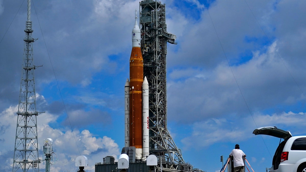 Photographers place remote cameras near the Artemis 1 rocket