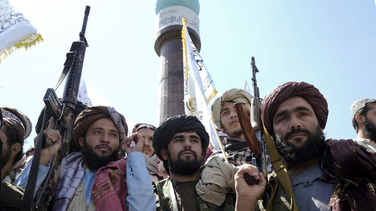 Taliban fighters celebrate