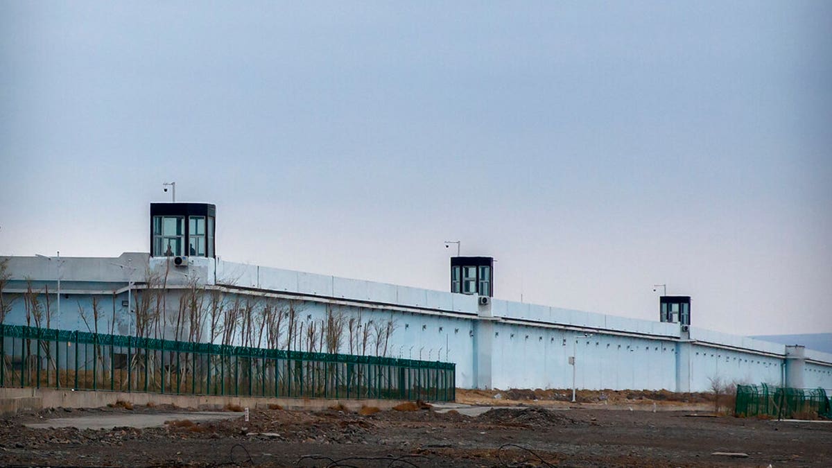 Guard towers stand on the perimeter wall of the Urumqi No. 3 Detention Center in Dabancheng in western China's Xinjiang Uyghur Autonomous Region on April 23, 2021.