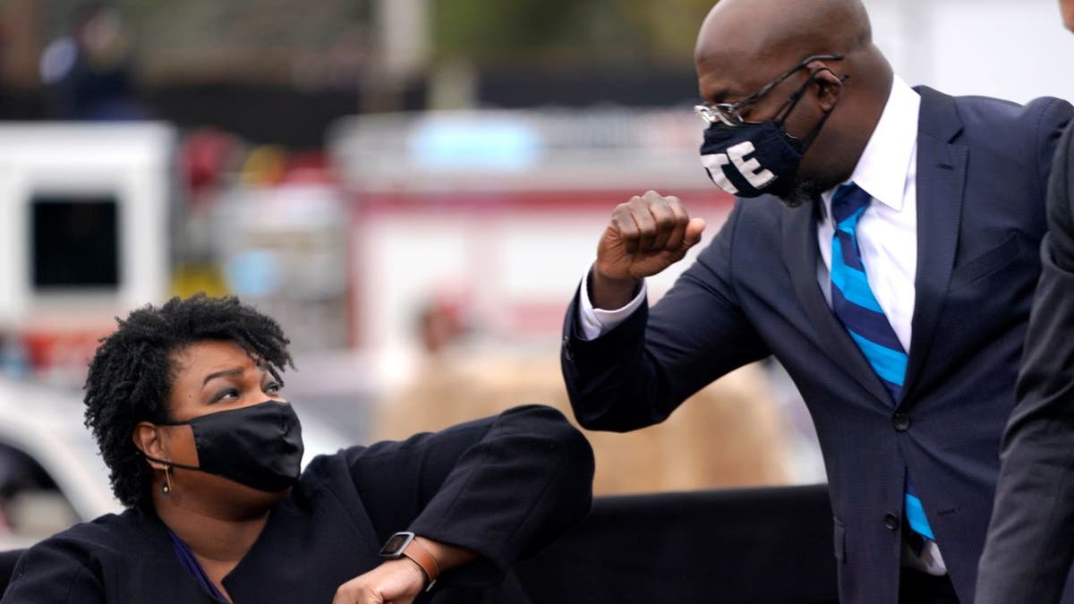 Democrats Stacey Abrams and Sen. Raphael Warnock campaign together in 2020