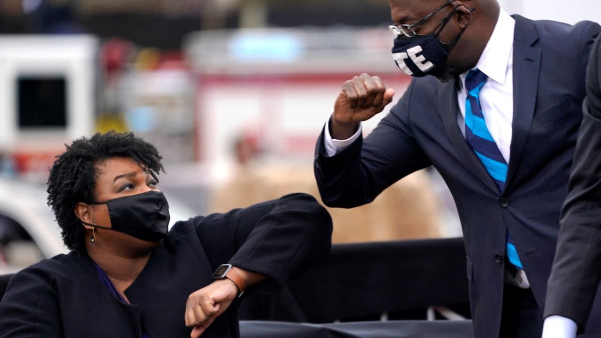 Democrats Stacey Abrams and Sen. Raphael Warnock campaign together in 2020