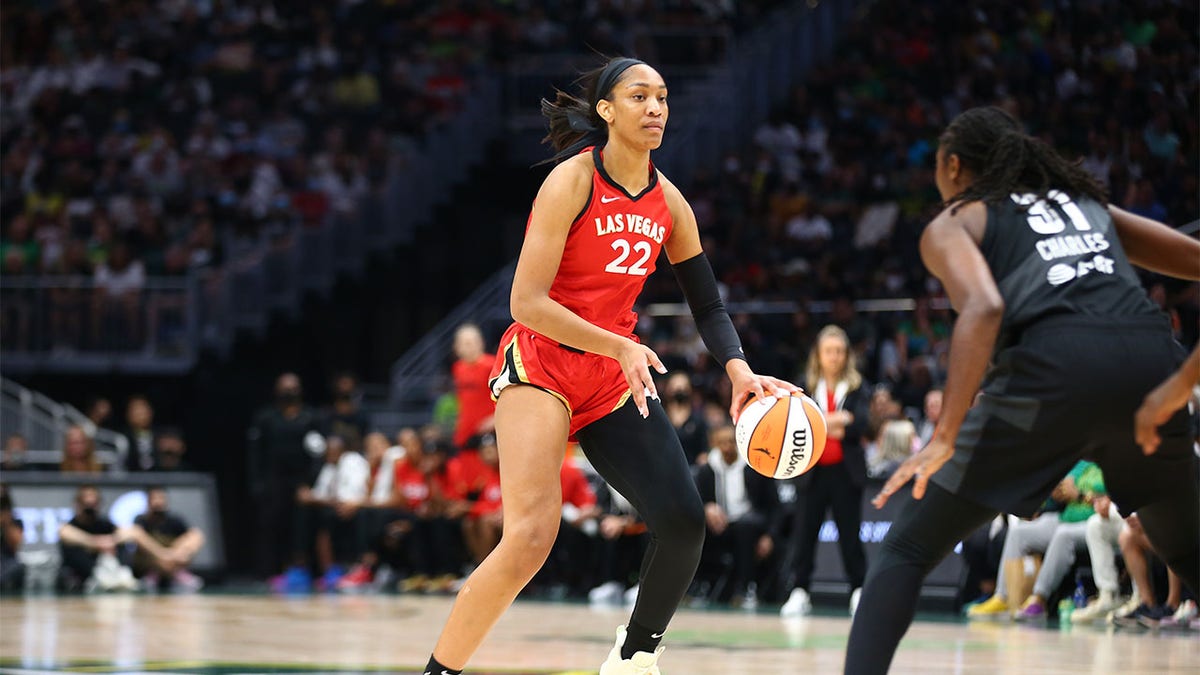 A'ja Wilson dribbles the ball