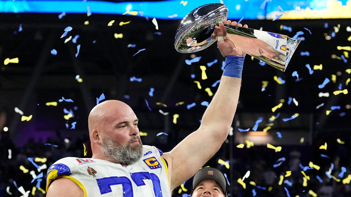Andrew Whitworth holds the Lombardi Trophy