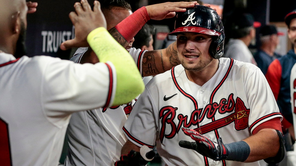Austin Riley celebrates with teammates