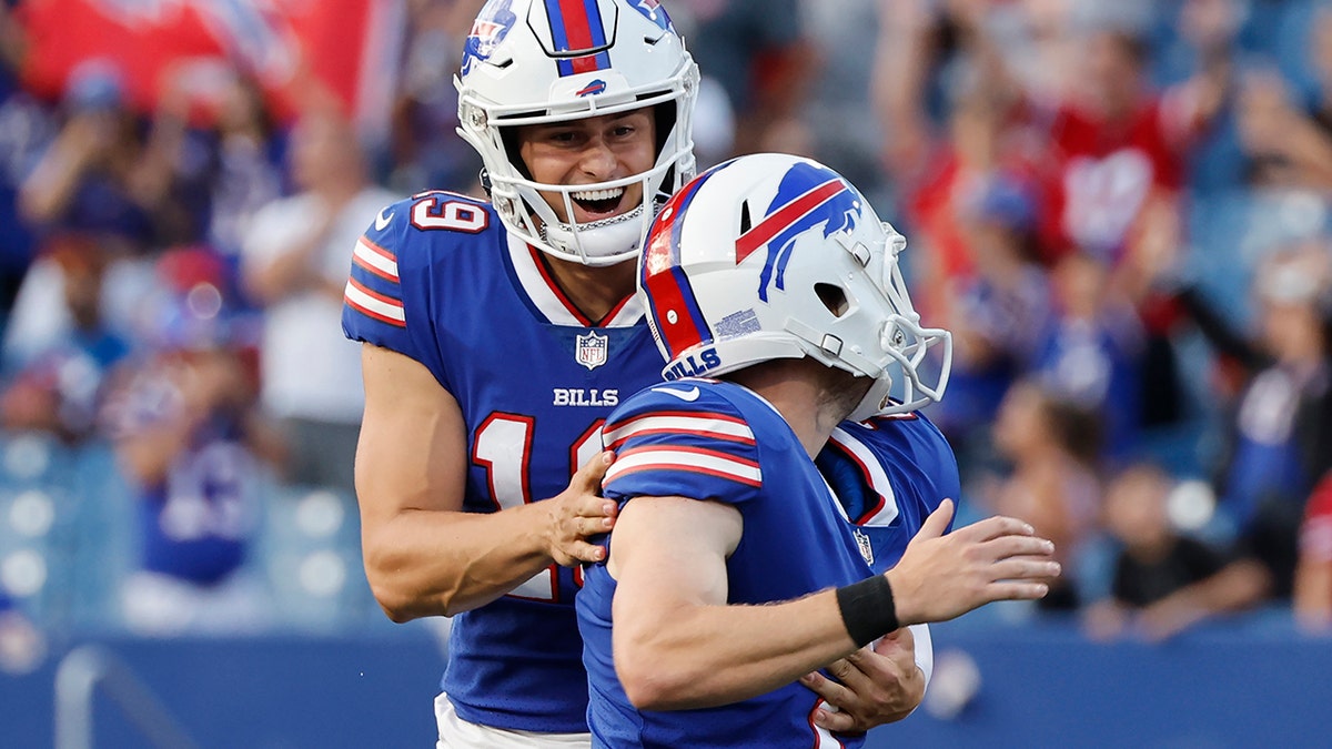 Bills punter Matt Araiza celebrates with Tyler Bass