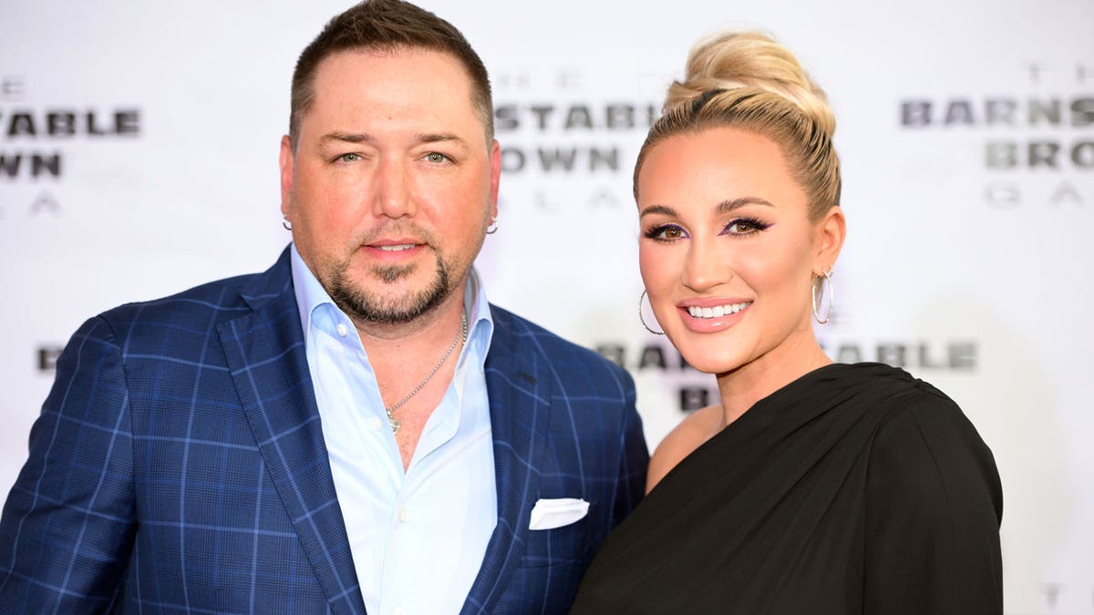 Jason Aldean and Brittany Aldean walk the red carpet