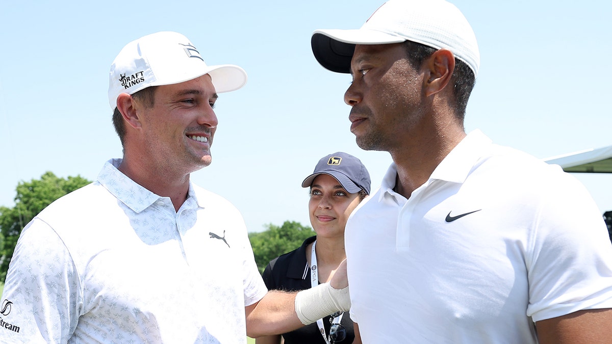 Bryson DeChambeau with Tiger Woods