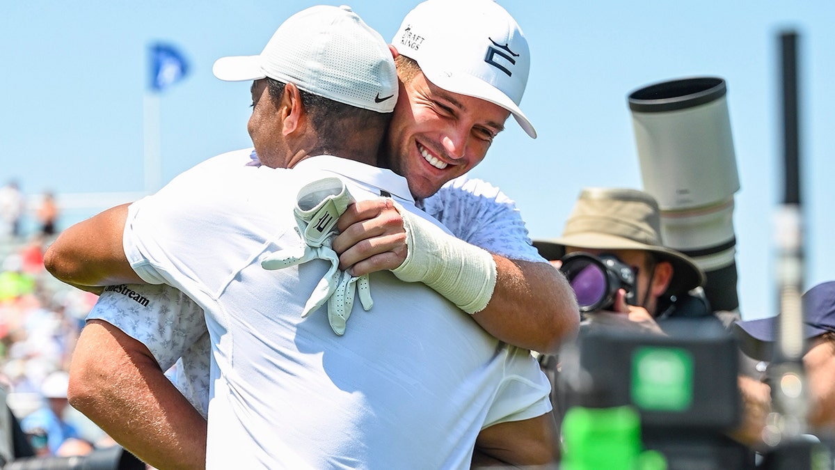 Tiger Woods hugs Bryson DeChambeau