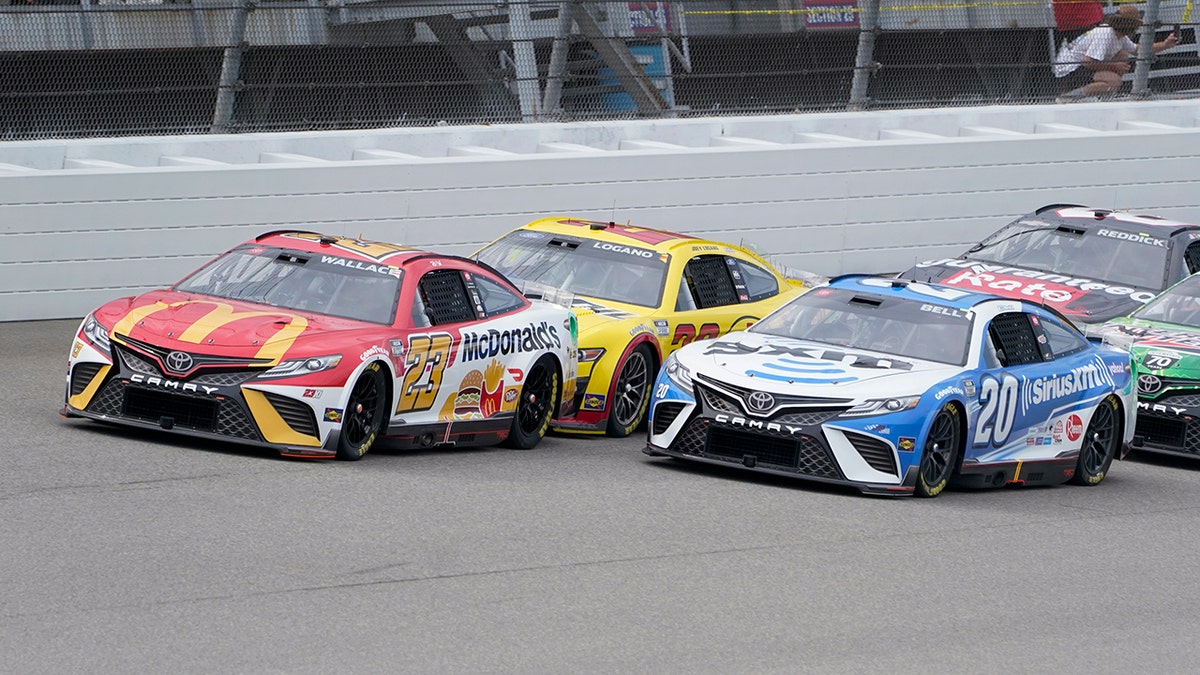 Bubba Wallace races with Christopher Bell