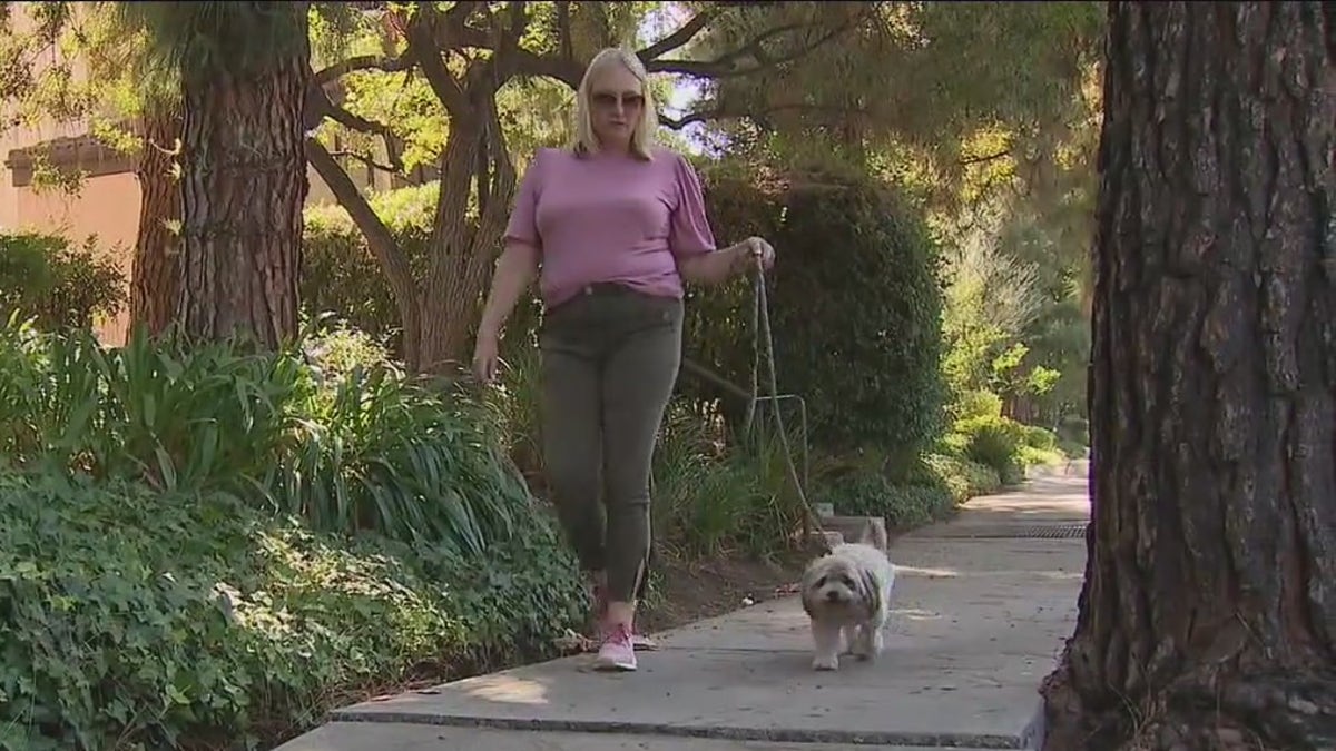 Lori Burns walking her dog, Chance the Rapper