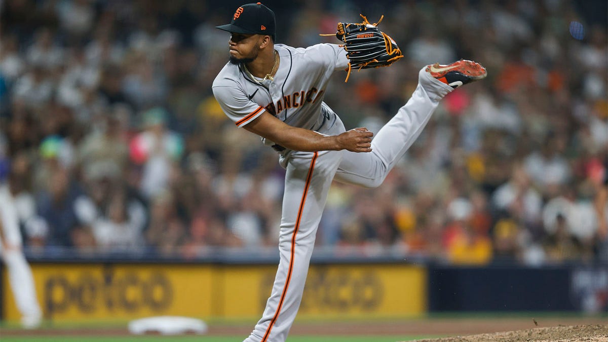 Camilo Doval throws pitch
