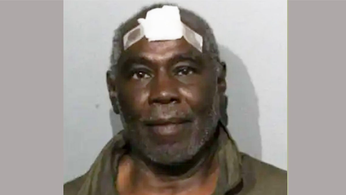 Mug shot of Bryan Sutton with a bandage on his head