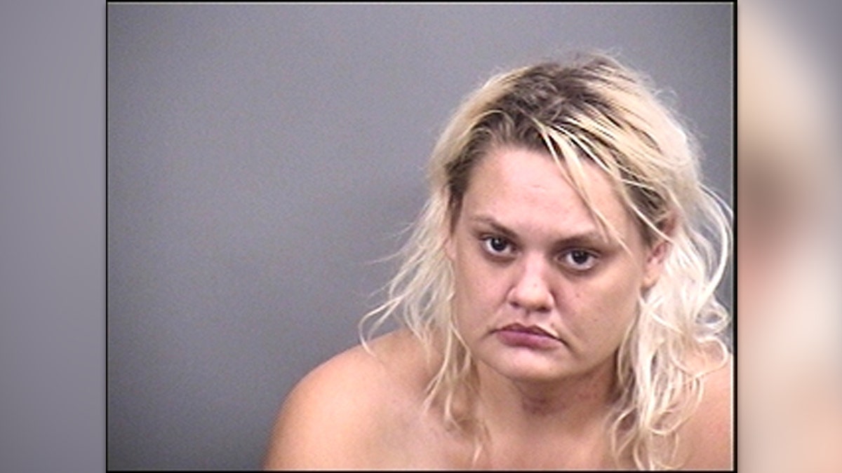 Rachael Zion Clay frowns in mugshot