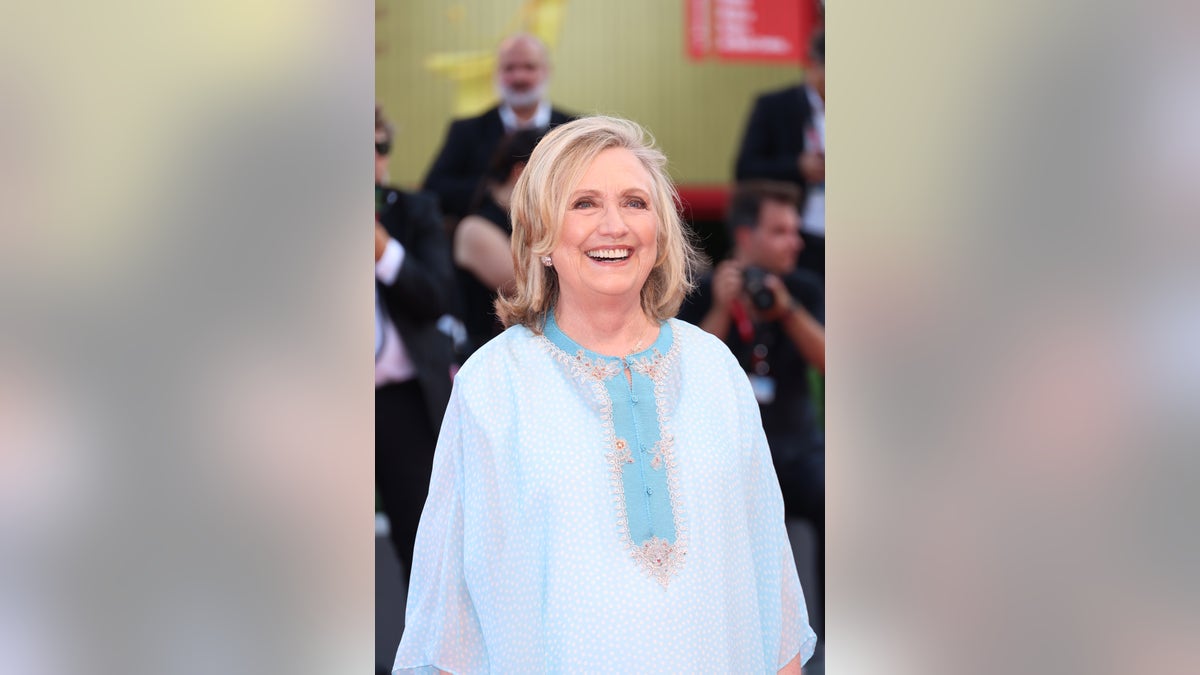 Hilary Clinton flashes a smile