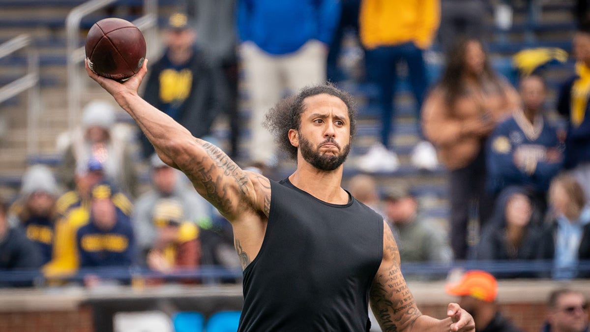 Colin Kaepernick throwing a football