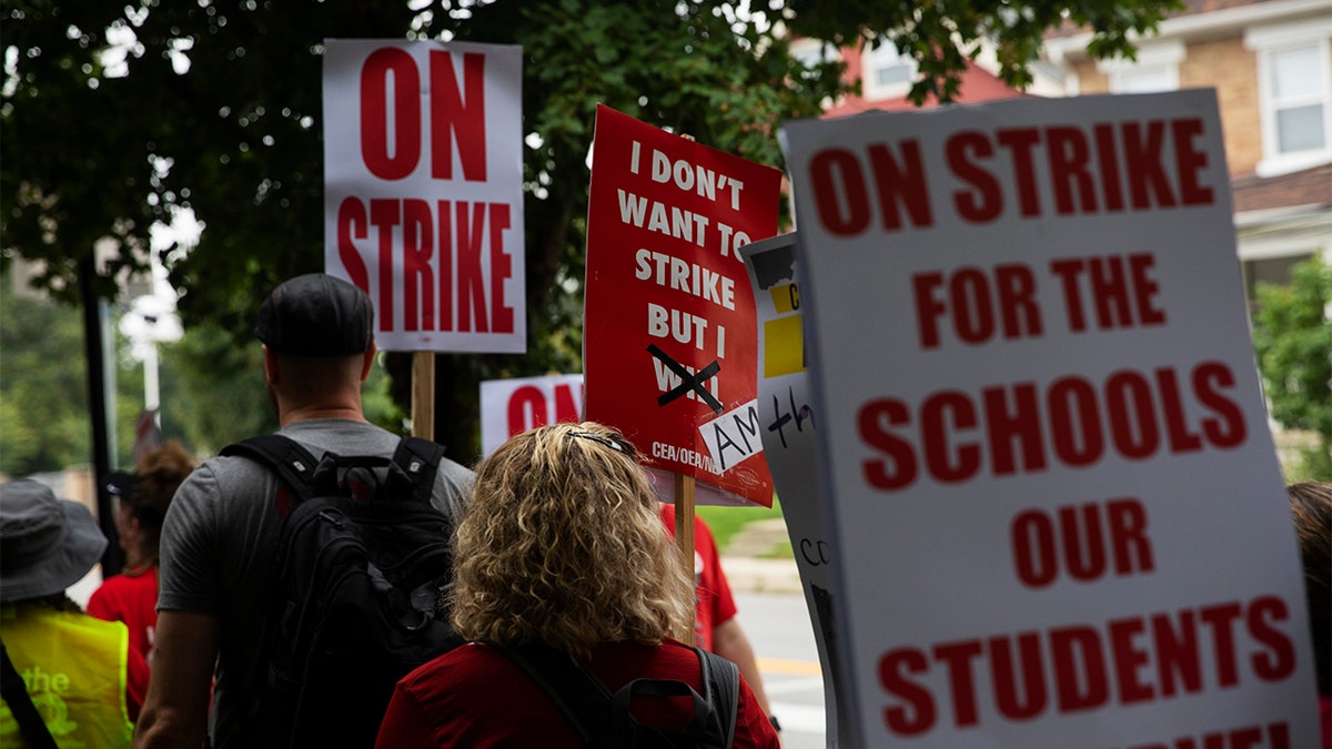 Teachers in Columbus City School System strike outside elementary school