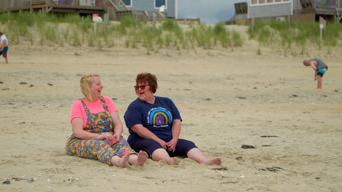 Diane and Mary sitting in the sand