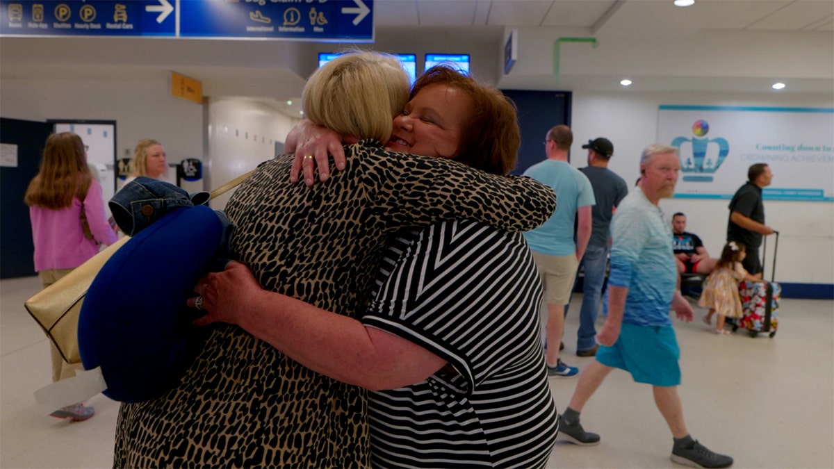 Diane and Mary meeting at the airport