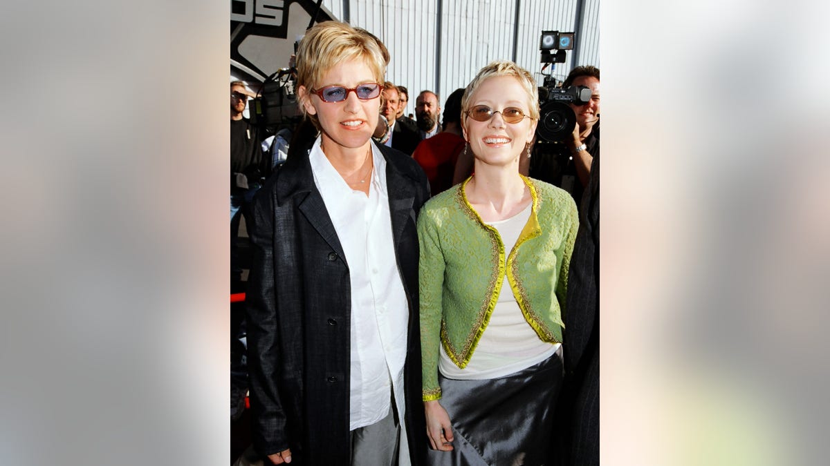Anne Heche and Ellen DeGeneres pose for a picture together in 1998