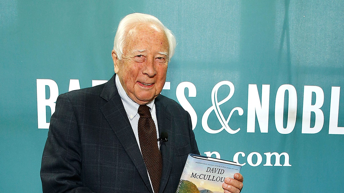 David McCullough holding one of his books