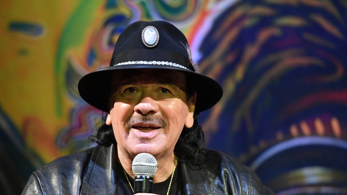 Carlos Santana on the microphone
