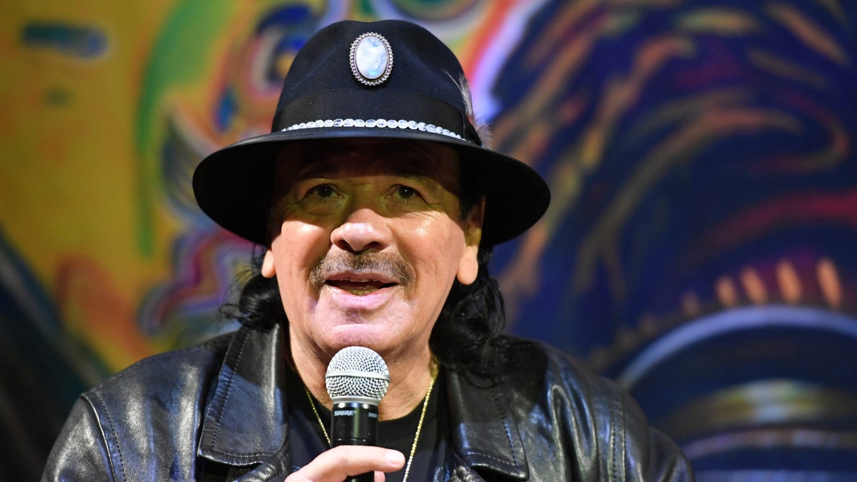 Carlos Santana on the microphone