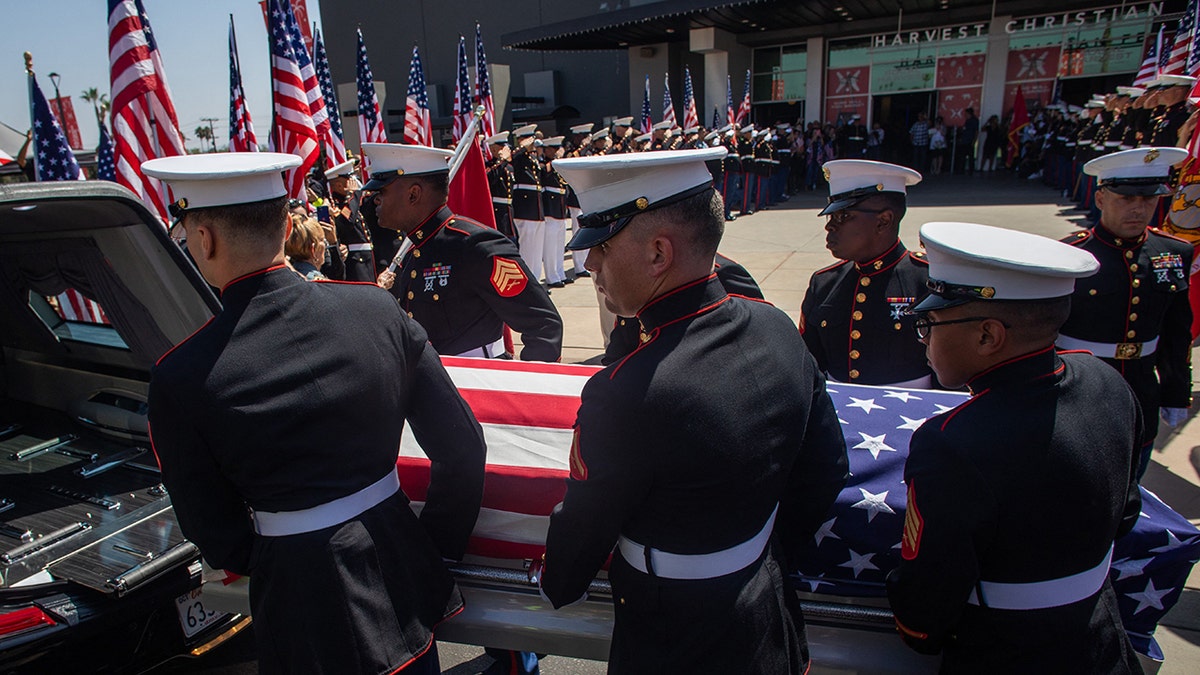 Marine Lance Cpt. Kareem Grant Nikoui casket carried by fellow soldiers