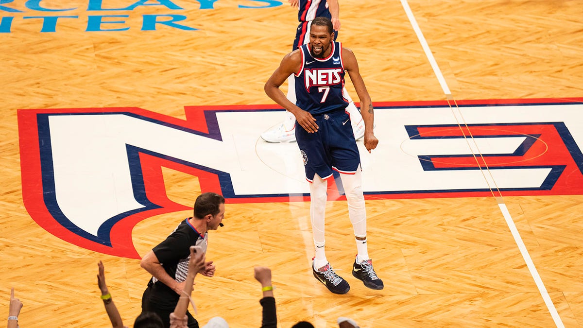 Kevin Durant celebrates on Brooklyn's home floor