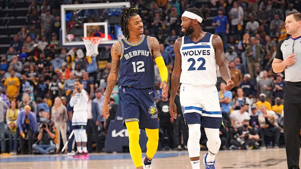 Ja Morant and Patrick Beverley talk during their playoff game