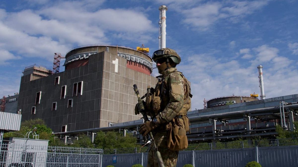 A Russian serviceman patrols the territory of the Zaporizhzhia Nuclear Power Station in Energodar on May 1, 2022. 