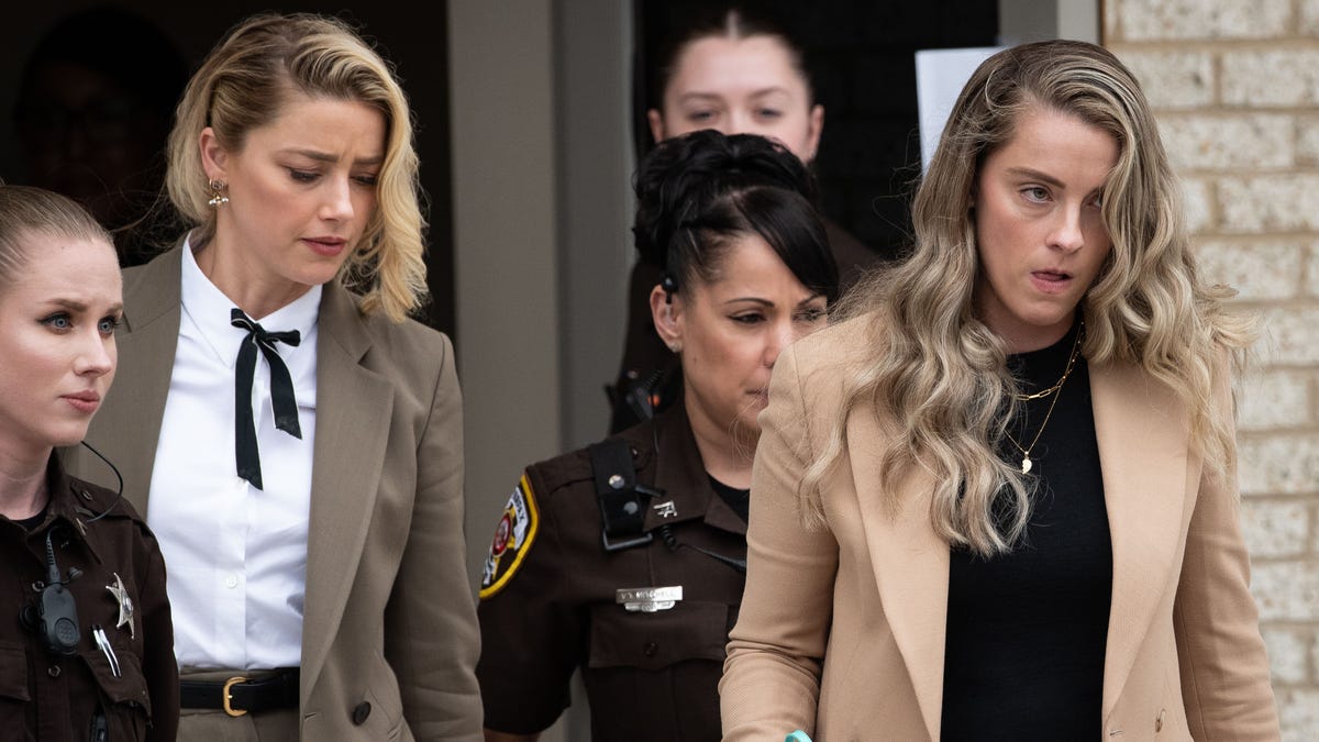 Amber Heard and her sister Whitney at trial