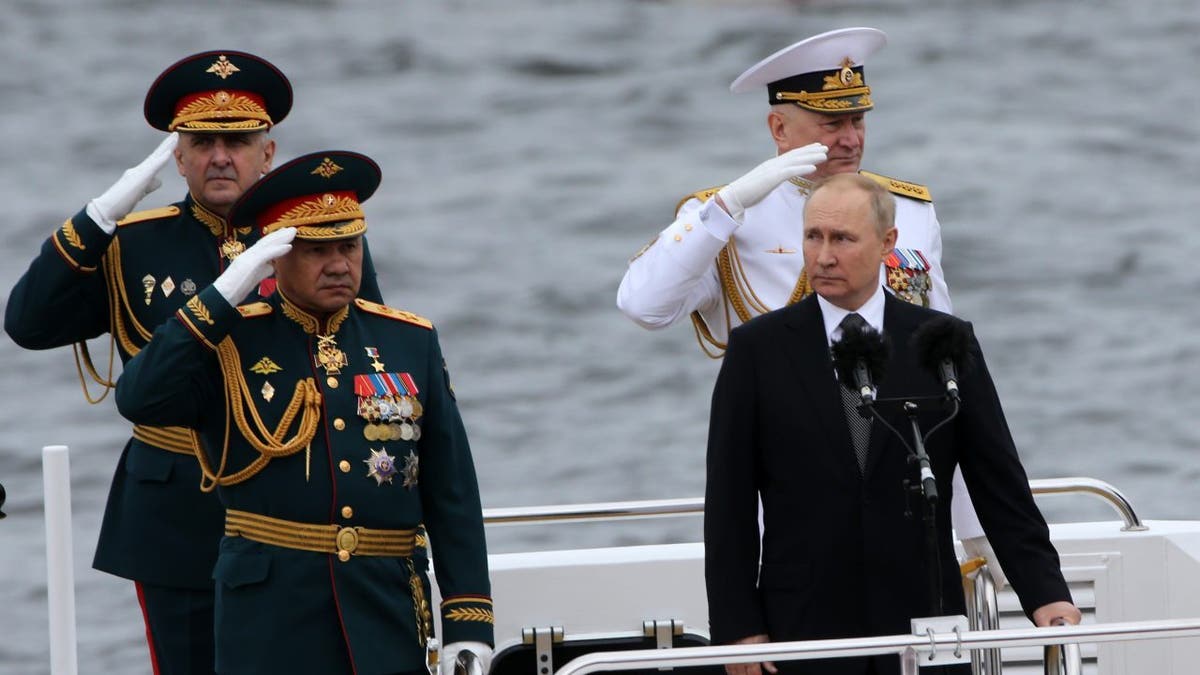 Vladimir Putin and military soldiers