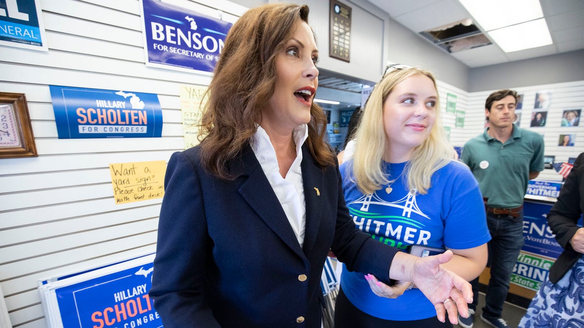 Michigan Governor Gretchen Whitmer (left) meets with volunteers