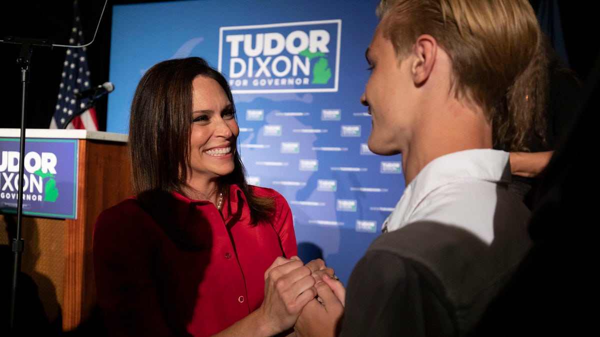 Michigan Republican gubernatorial candidate Tudor Dixon (L) celebrates her win on primary election night