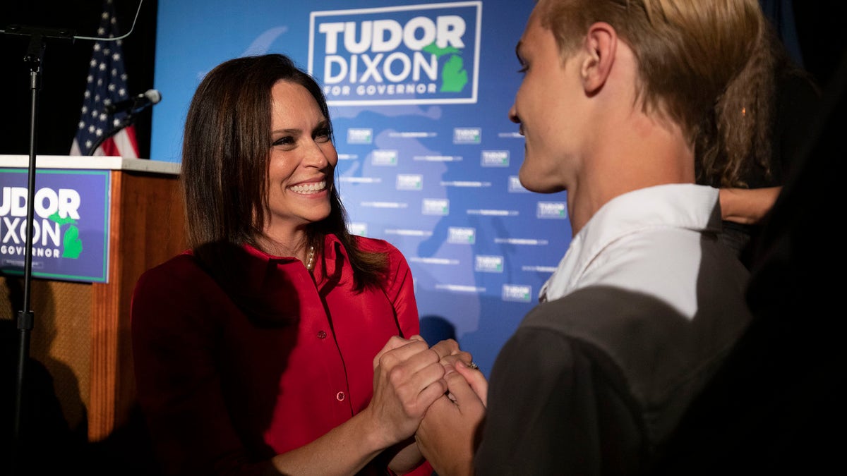 Michigan Republican gubernatorial candidate Tudor Dixon (L) celebrates her win on primary election night