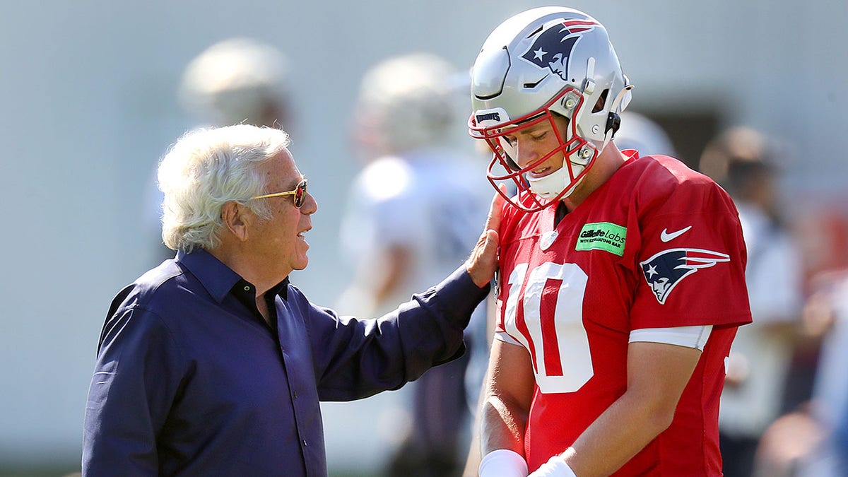 Patriots owner Robert Kraft speaks with Mac Jones