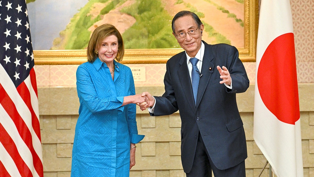 A photo of Nancy Pelosi with Japan's Hiroyuki Hosoda