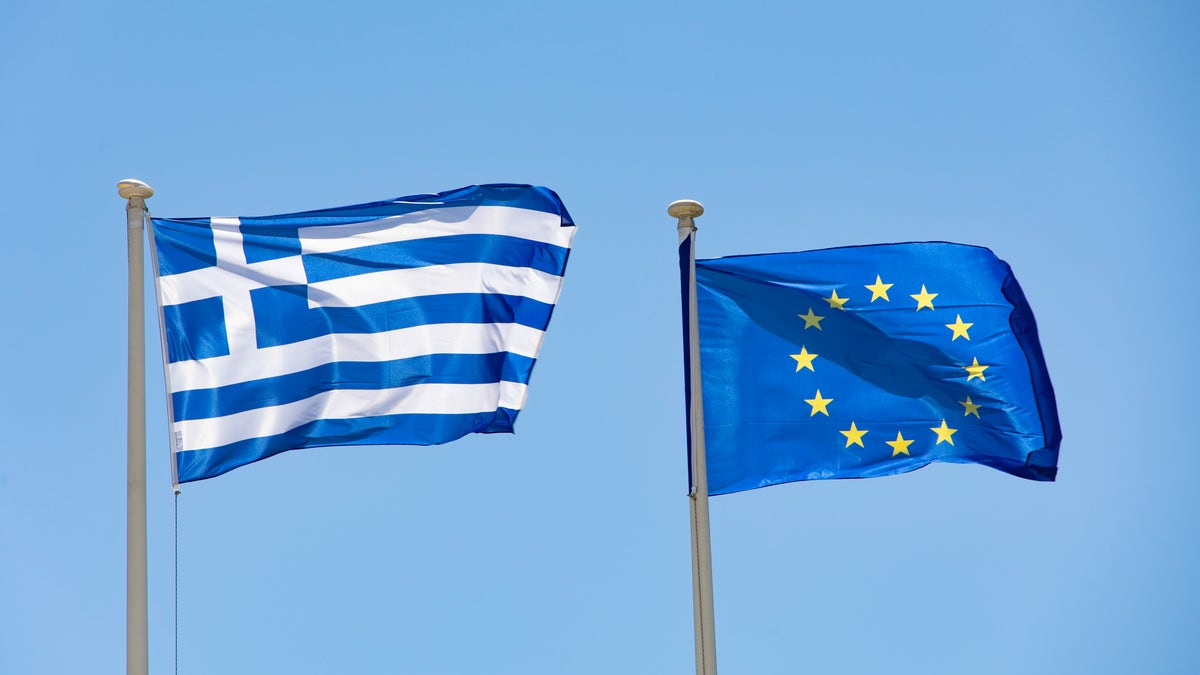 Greek flag next to EU flag