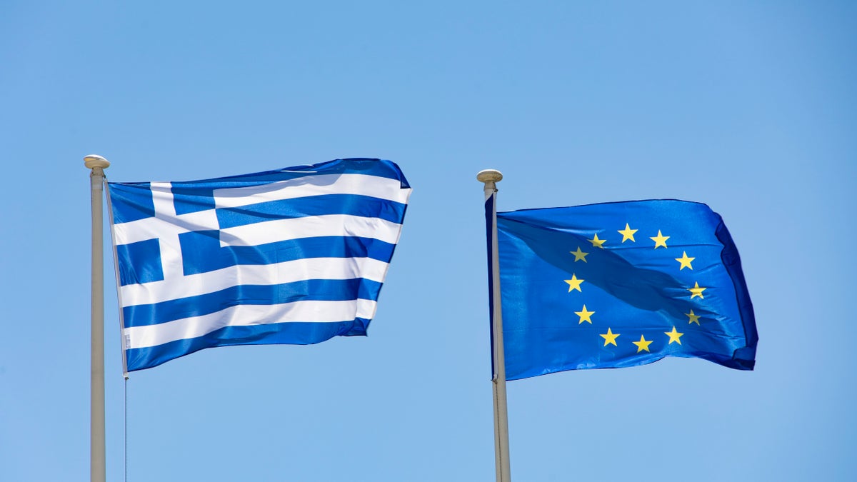 Greek flag next to EU flag