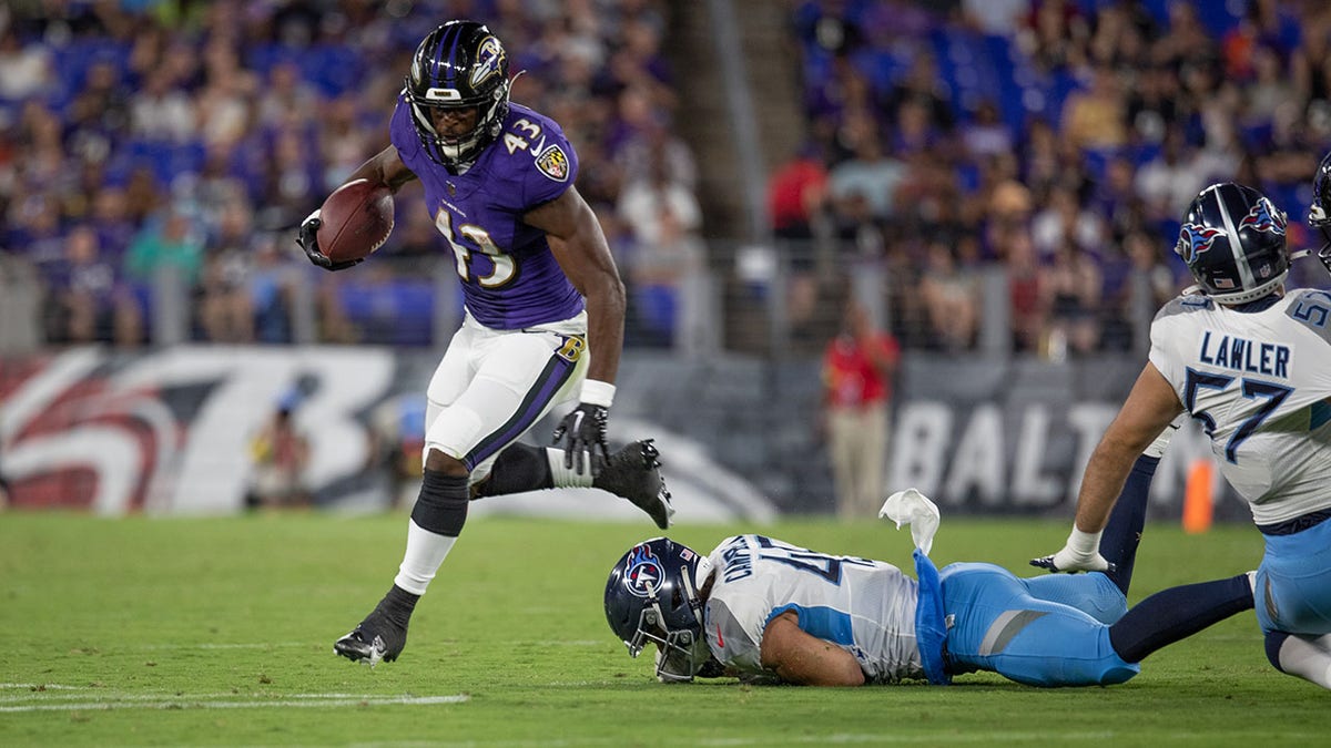 Ravens running back Justice Hill during a preseason game 