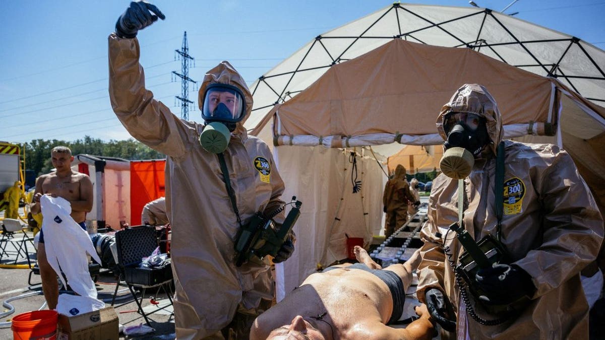 Zaporizhzhia nuclear power plant workers wear radioactive suits for emergency drill