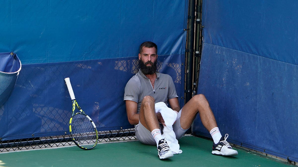 Benoit Paire sits on the court at the US Open