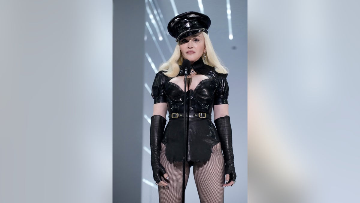 Madonna on stage in black leather