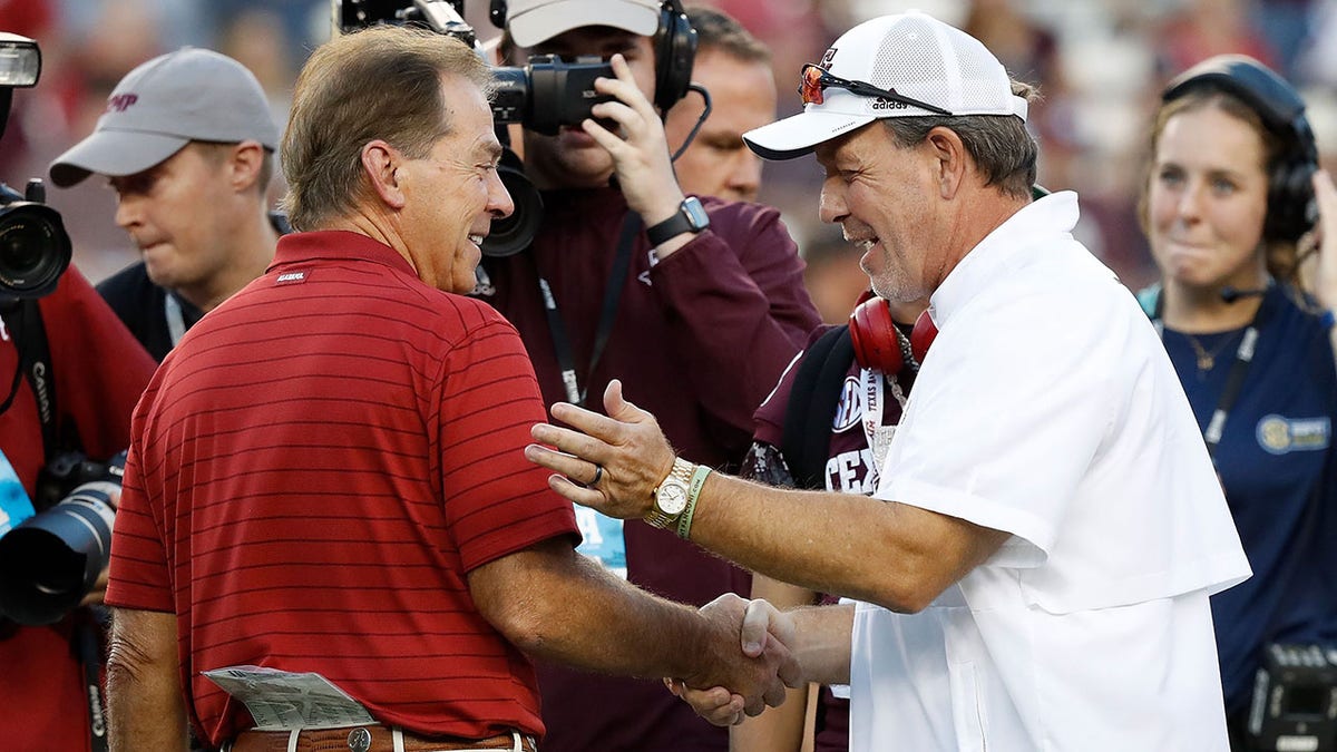 Nick Saban and Jimbo Fisher before a 2021 game