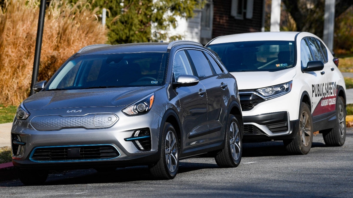 A Kia and a police car