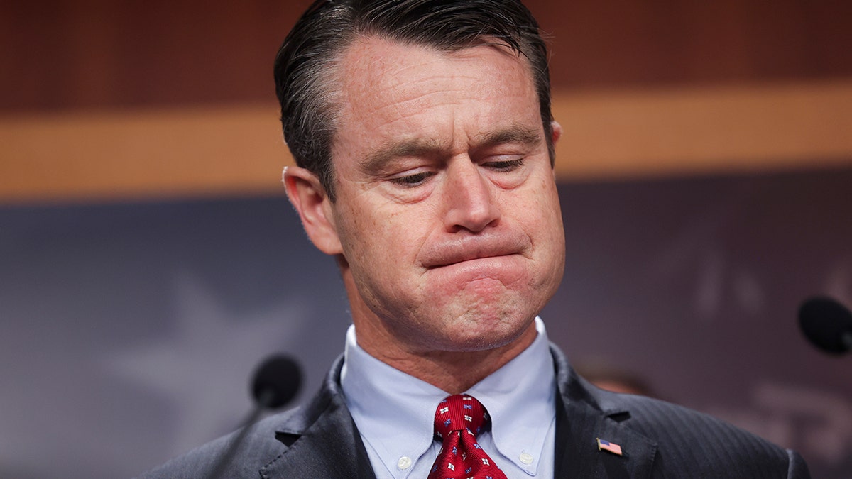 A photo of Sen. Todd Yound with his head down
