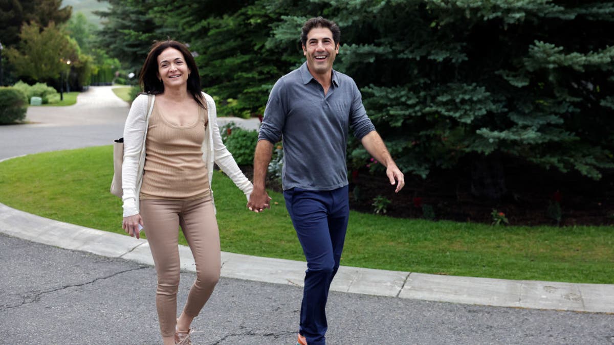 Sheryl Sandberg and Tom Bernthal on a walk