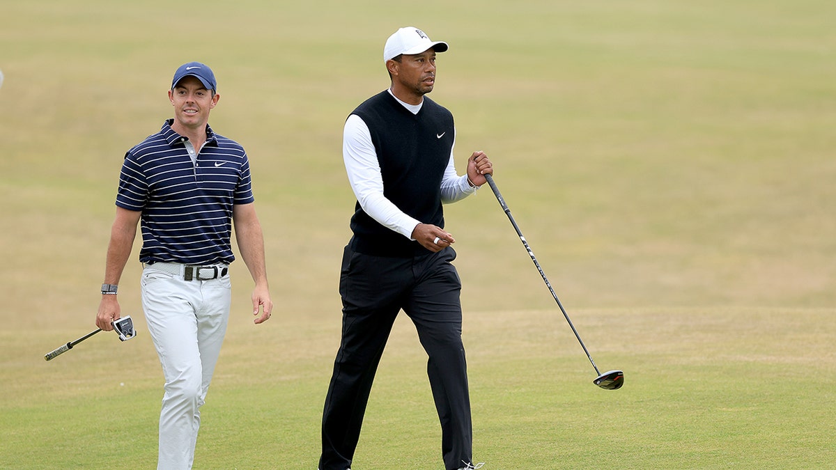 Tiger Woods and Rory McIlroy walk together