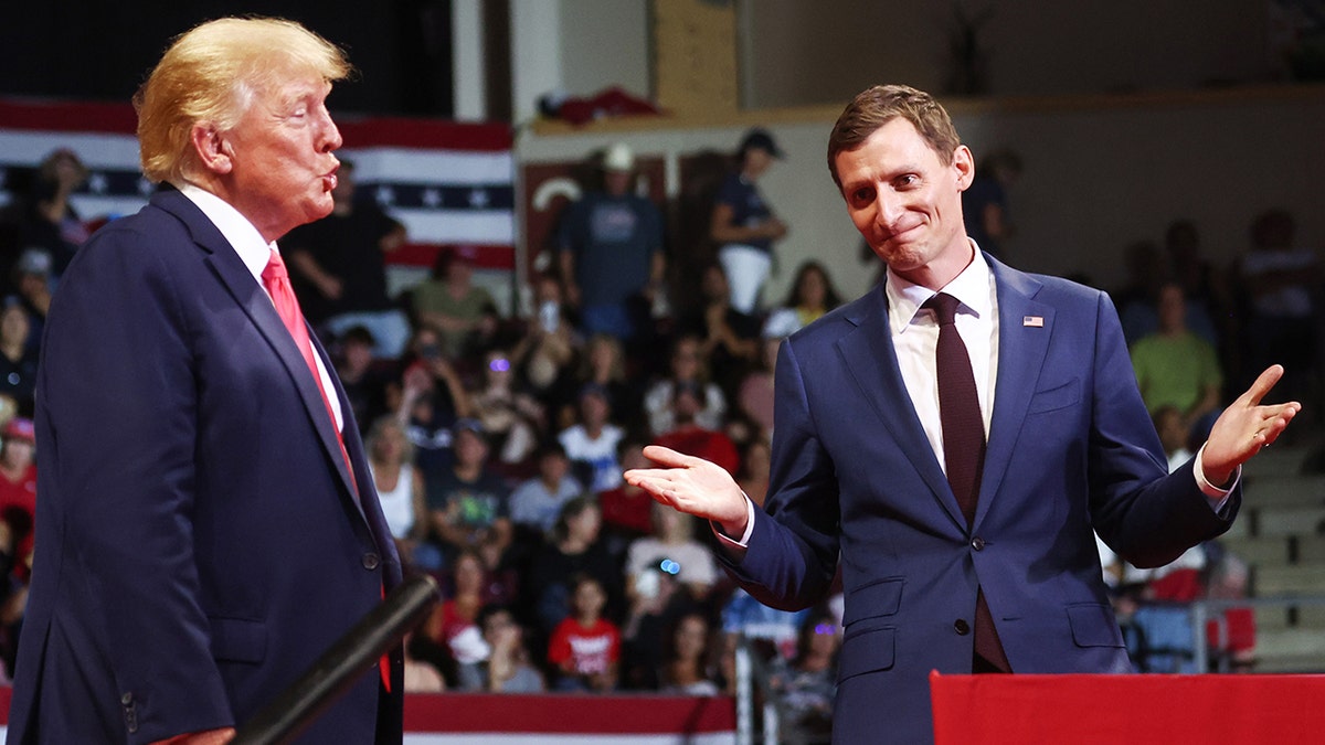 A photo of Donald Trump with Blake Masters at a rally